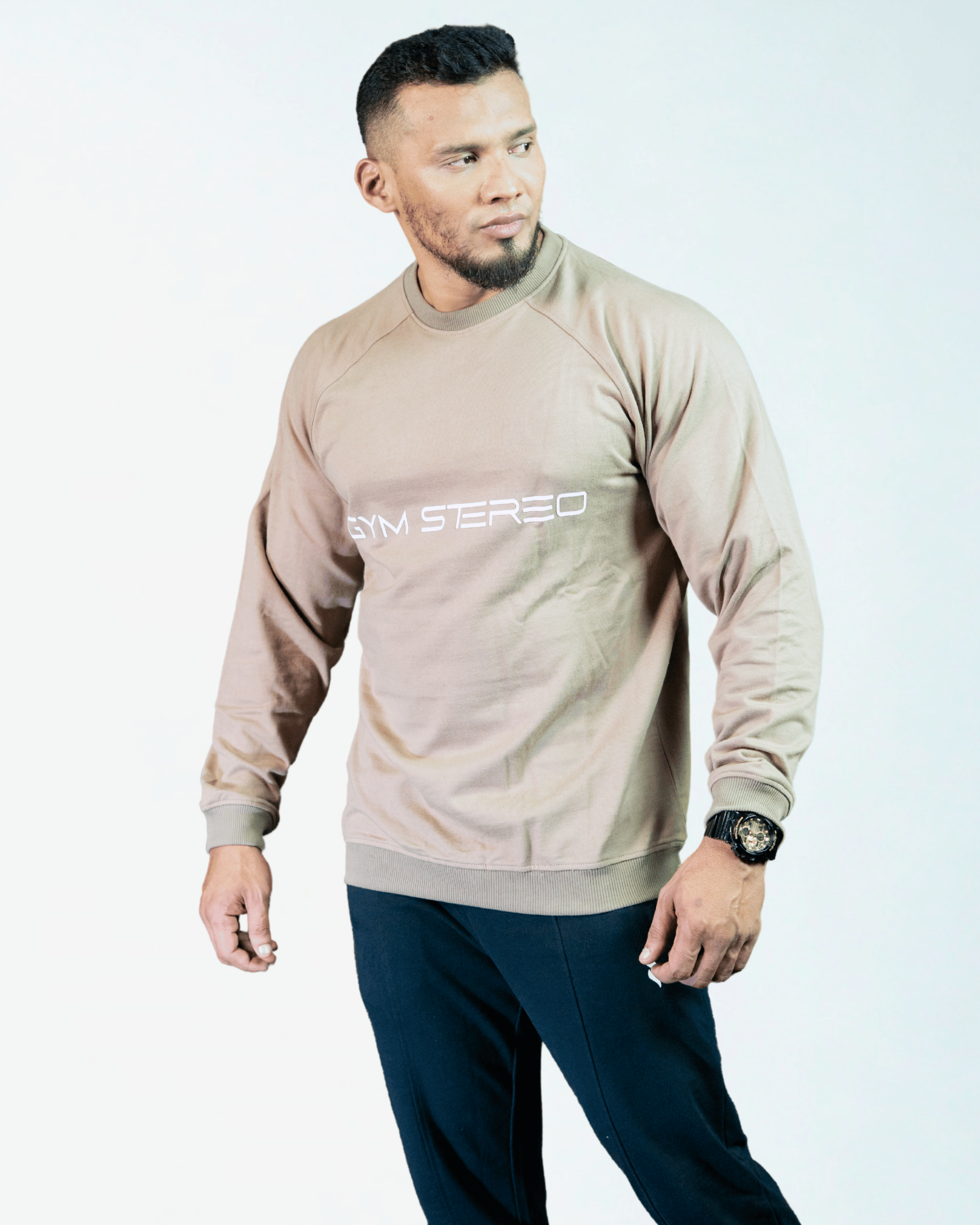 Man wearing a beige sweatshirt with text on a white background